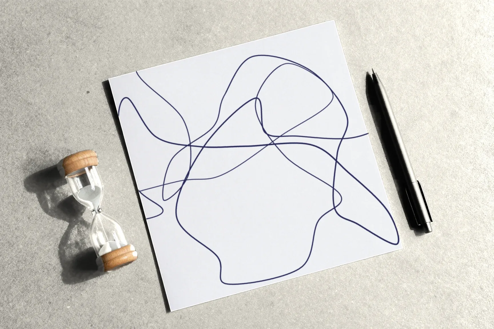 A sheet with two loose lines, a small sand timer and a fine-liner beside it.